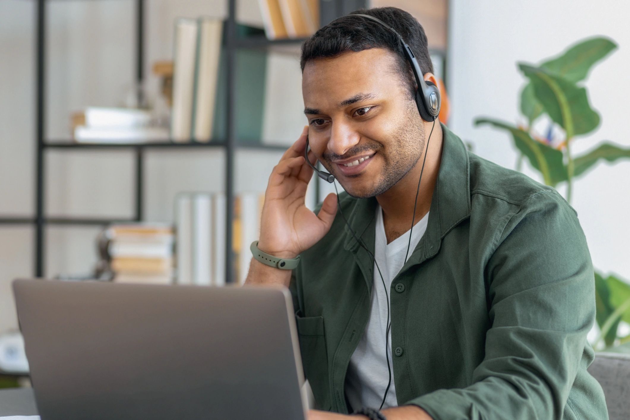 Customer wearing headset in home office