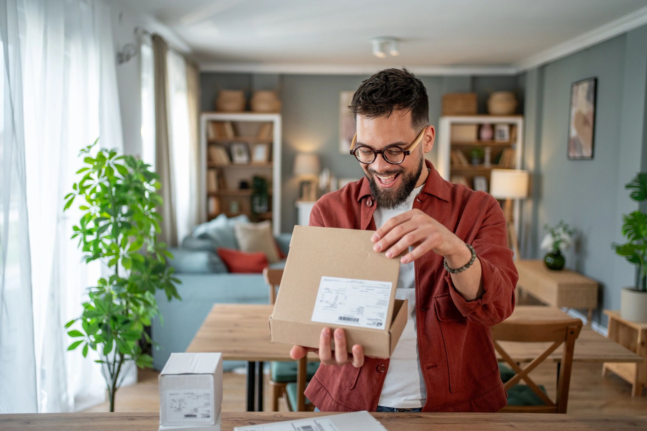 Customer unboxing a delivery at home